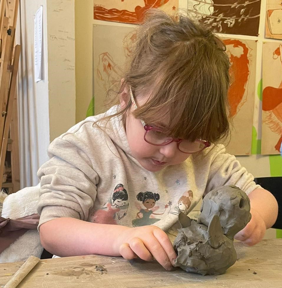 Child moulding clay.