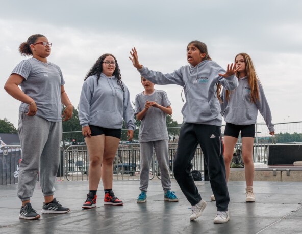 Group of teenagers break dancing