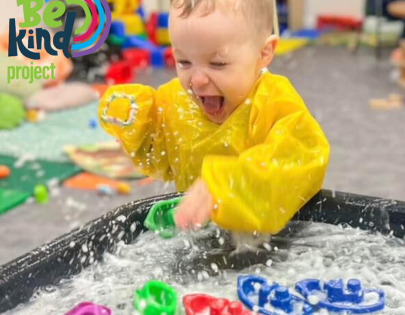 Toddler taking part in water play